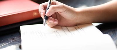 writing in book | coursework